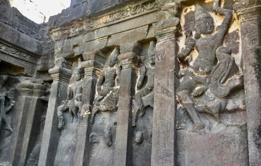 Ellora Caves-stone carvings of human figurine on walls